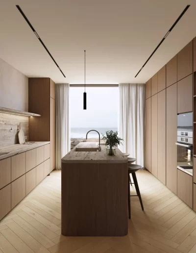 Cozinha do projeto The Duneview House, com ilha central, carpintarias em nogueira mate e mármore travertino com veios horizontais.