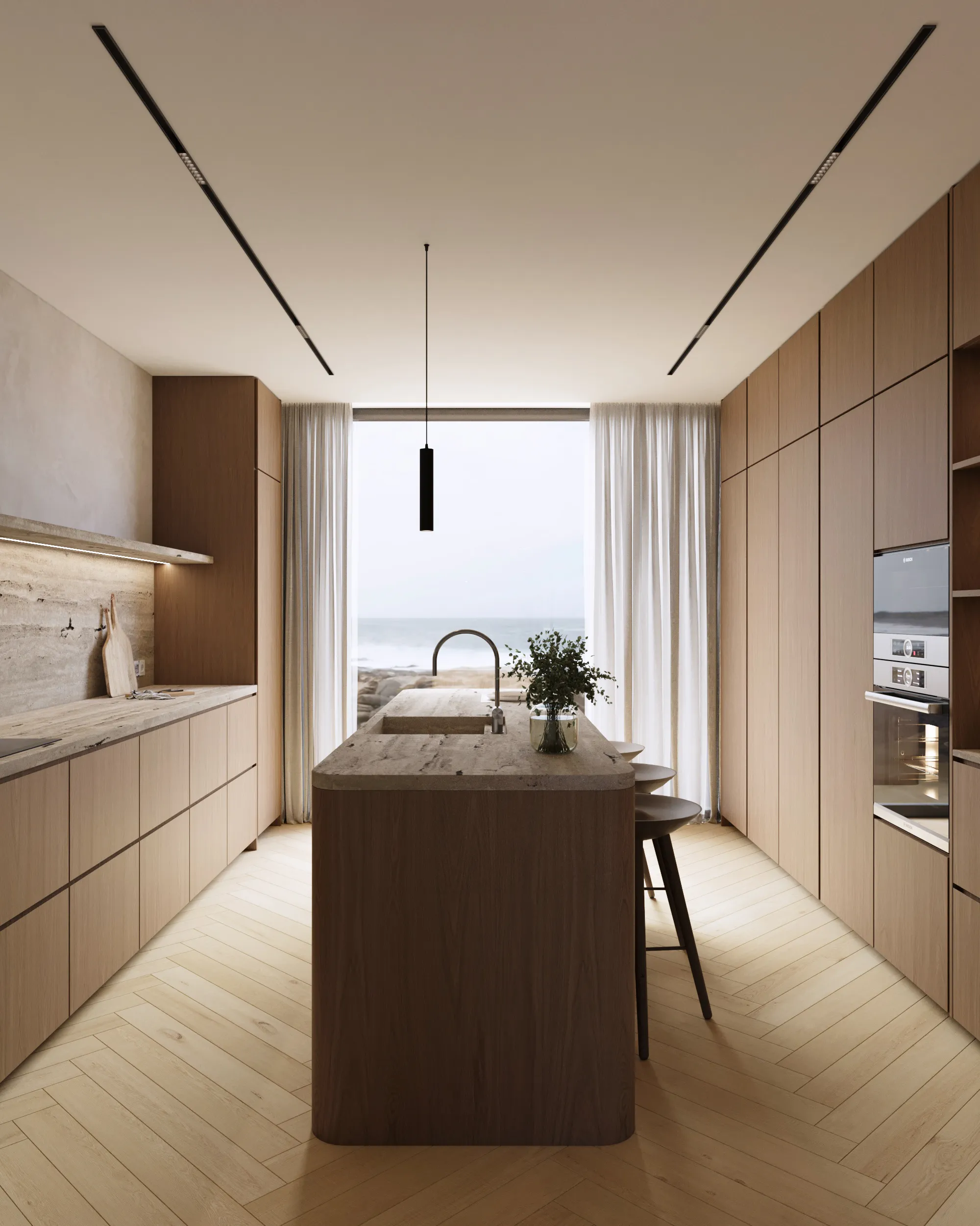 the-duneview-house_cozinha_casas-com-design Cozinha do projeto The Duneview House, com ilha central, carpintarias em nogueira mate e mármore travertino com veios horizontais.