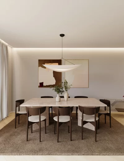 Sala de jantar do projeto The Duneview House, com mesa em mármore travertino, candeeiro em forma de nuvem e tapete escuro.